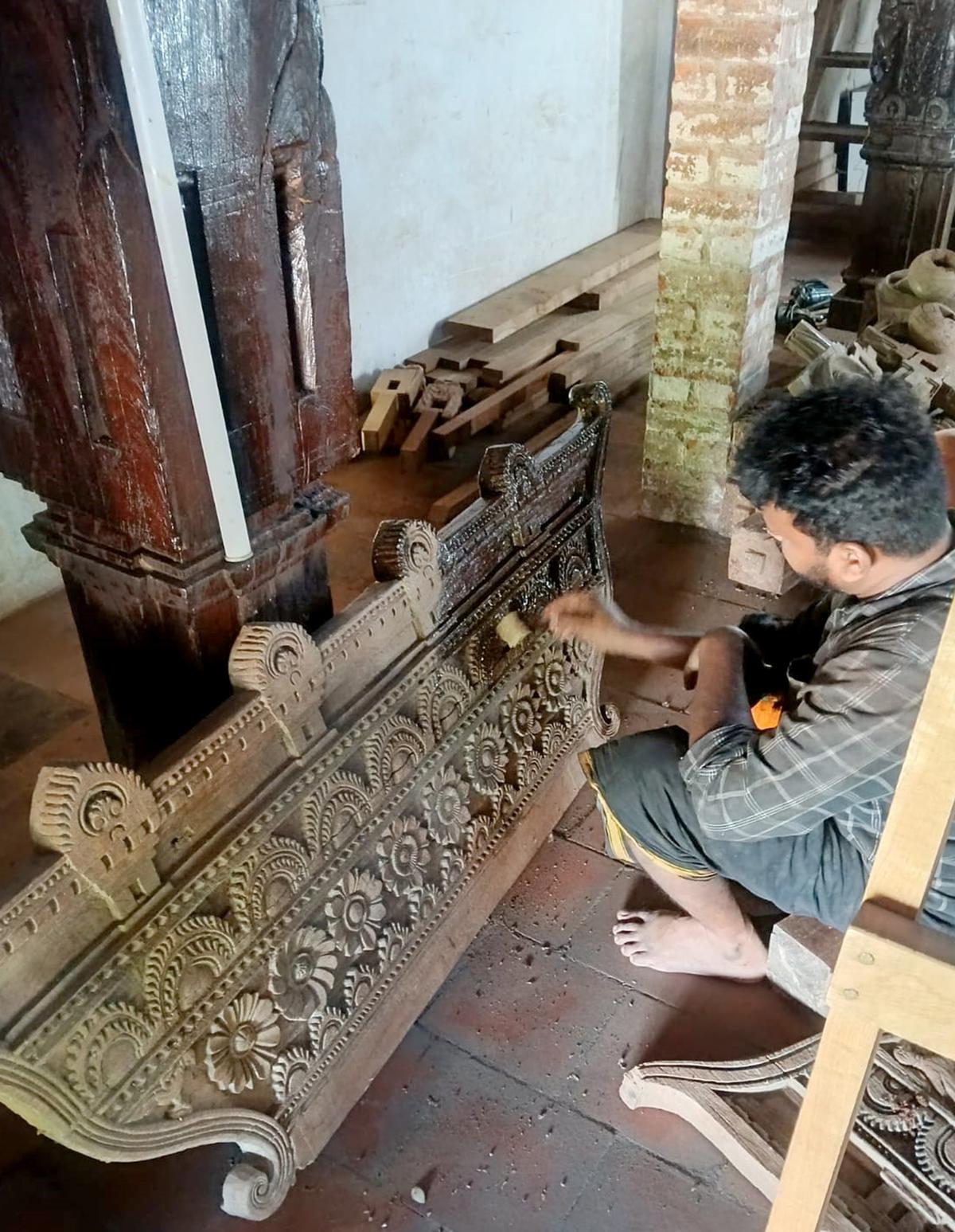 Artisans carrying out the restoration work of the east gopuram of Sree Vadakkunnathan Temple in Thrissur.